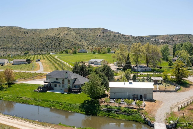 bird's eye view with a water and mountain view