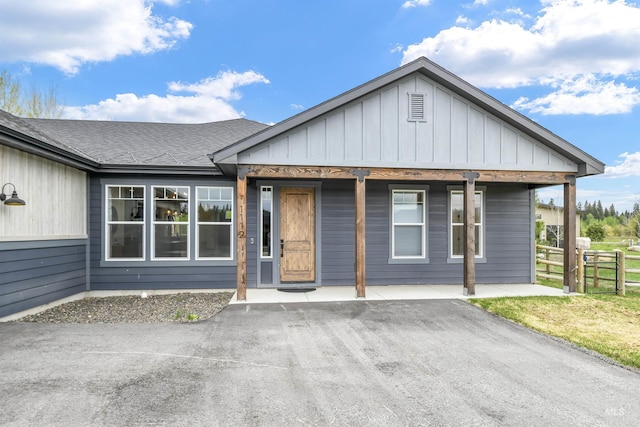 1112 Mos Way, Mccall, ID 83638 - view of front of house featuring board and batten siding and a shingled roof