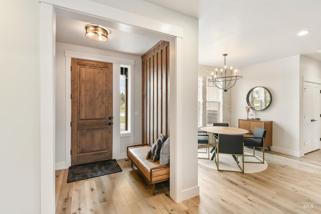 1112 Mos Way, Mccall, ID 83638 - entrance foyer featuring light wood-type flooring, a chandelier, baseboards, and recessed lighting