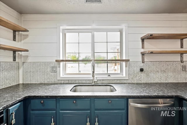 12091 Long St, Middleton, ID 83644 - kitchen with open shelves, blue cabinetry, dishwasher, and a sink