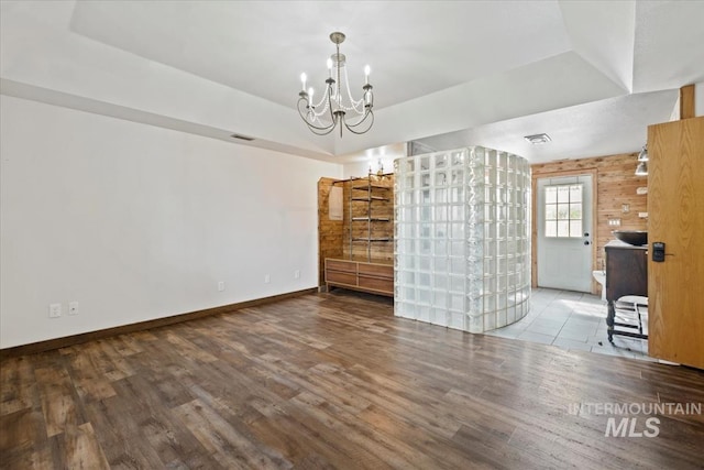 12091 Long St, Middleton, ID 83644 - unfurnished living room with wood finished floors, a chandelier, and baseboards