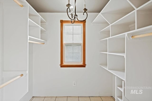 12091 Long St, Middleton, ID 83644 - spacious closet featuring tile patterned flooring and a chandelier