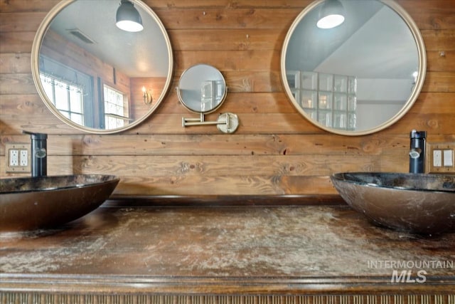 12091 Long St, Middleton, ID 83644 - bathroom featuring wooden walls and double vanity