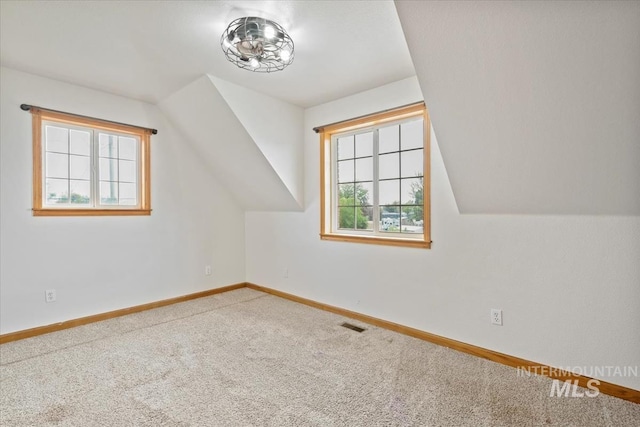 12091 Long St, Middleton, ID 83644 - additional living space with carpet flooring, baseboards, and lofted ceiling