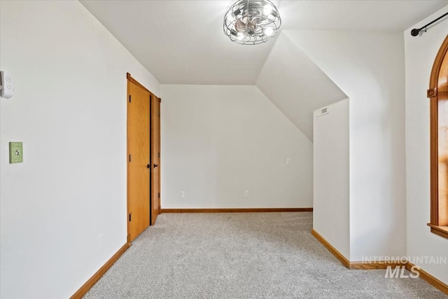 12091 Long St, Middleton, ID 83644 - bonus room with light carpet, lofted ceiling, and baseboards