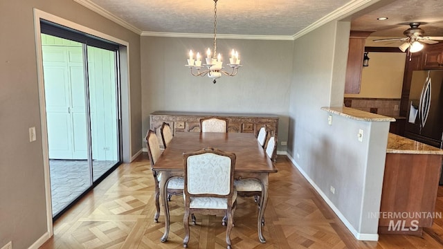 dining room featuring a chandelier, baseboards, a ceiling fan, and crown molding