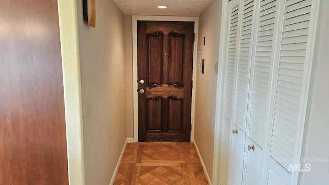 hallway featuring baseboards