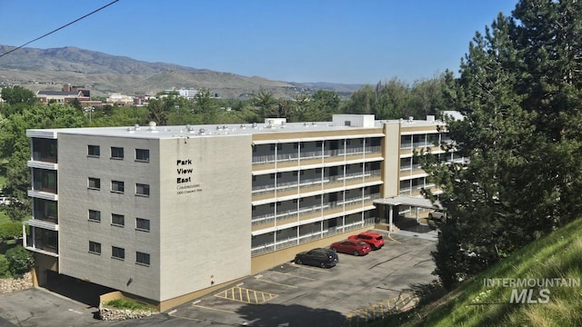 view of apartment building / complex featuring a mountain view