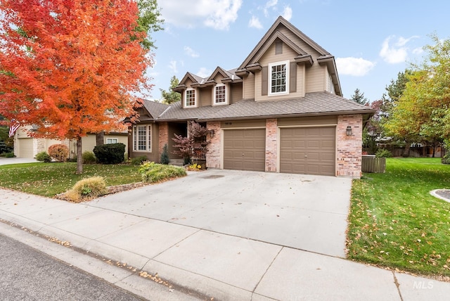 view of front facade with a front yard and a garage