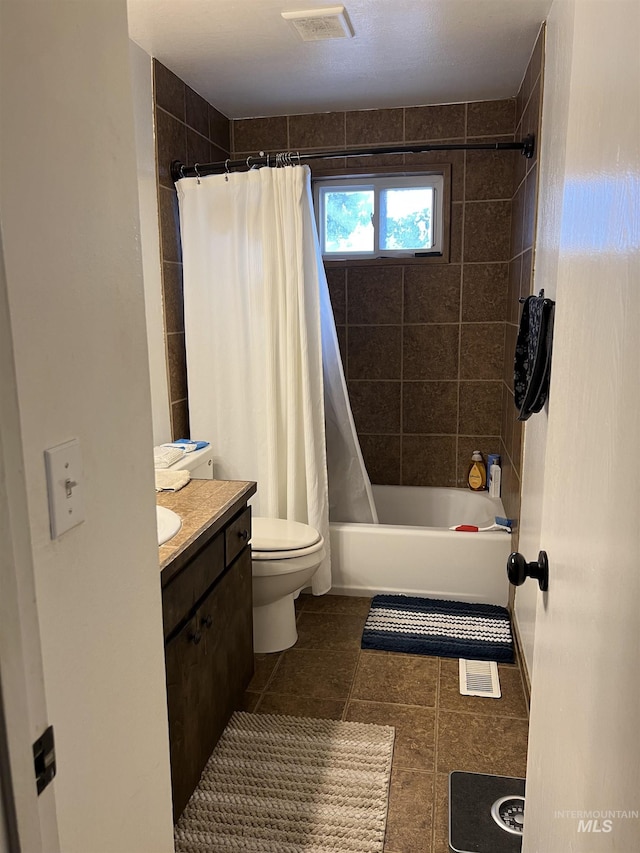 full bathroom featuring shower / bath combo with shower curtain, vanity, and toilet