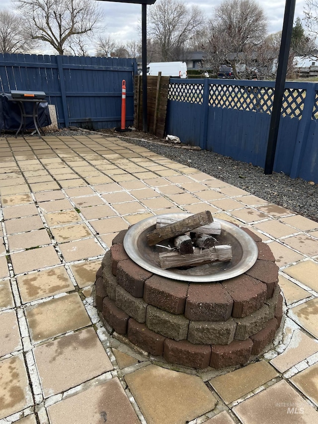 view of patio / terrace featuring a fire pit