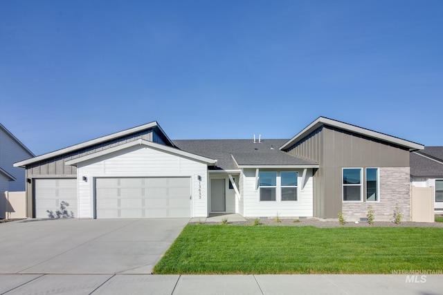 view of front facade featuring an attached garage, driveway, roof with shingles, board and batten siding, and a front yard