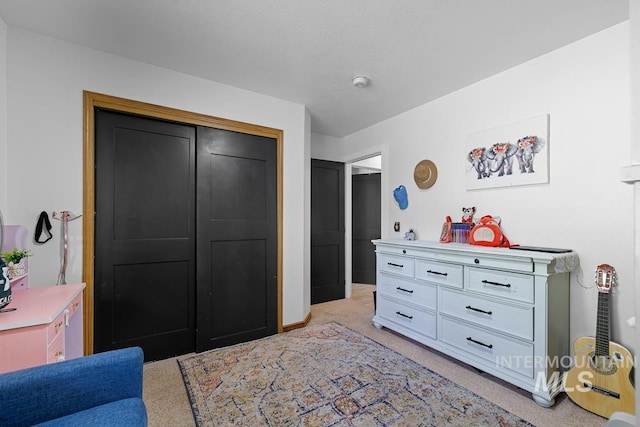 carpeted bedroom with a closet