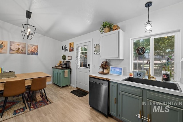 kitchen with light hardwood / wood-style flooring, a wealth of natural light, sink, and stainless steel dishwasher