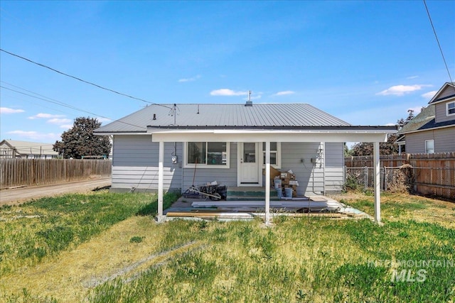 414 Yakima Ave, Filer, ID 83328 - rear view of house featuring a fenced backyard and a metal roof