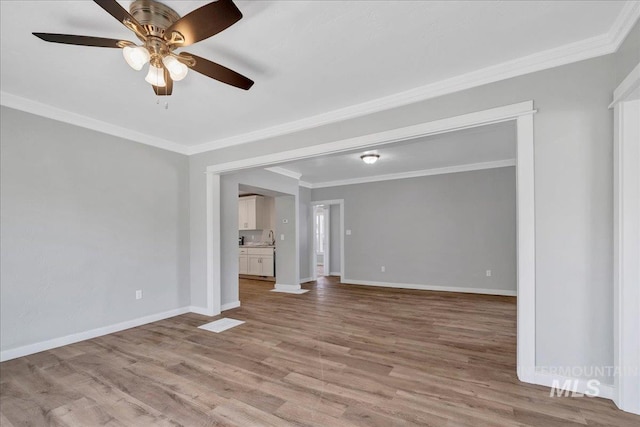 414 Yakima Ave, Filer, ID 83328 - unfurnished room featuring light wood finished floors, ornamental molding, and a ceiling fan