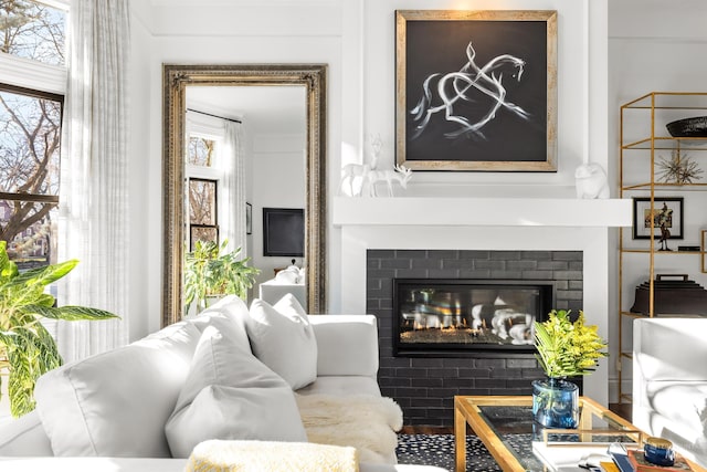 living room featuring a large fireplace