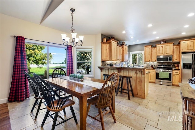 45 Ridge Loop, Jerome, ID 83338 - dining space featuring a chandelier, recessed lighting, and light stone finish flooring