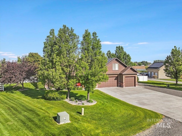 45 Ridge Loop, Jerome, ID 83338 - view of front of home featuring driveway, a front yard, and an attached garage