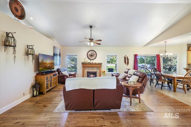 45 Ridge Loop, Jerome, ID 83338 - living room with lofted ceiling, a tile fireplace, plenty of natural light, a ceiling fan, and wood finished floors