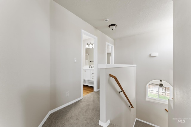 1406 W Wright St, Boise, ID 83705 - hall with an upstairs landing, baseboards, carpet, and a sink