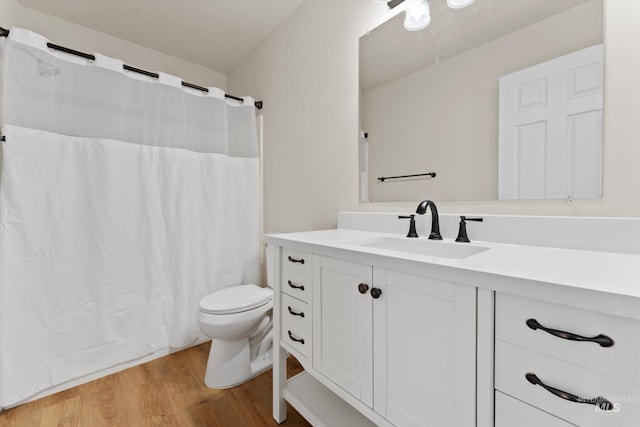 1406 W Wright St, Boise, ID 83705 - full bathroom featuring wood finished floors, vanity, toilet, and curtained shower