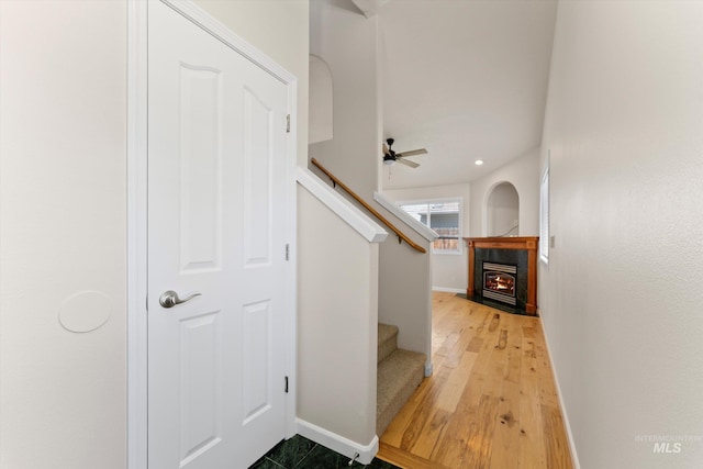 1406 W Wright St, Boise, ID 83705 - staircase featuring a fireplace with flush hearth, baseboards, wood finished floors, and ceiling fan