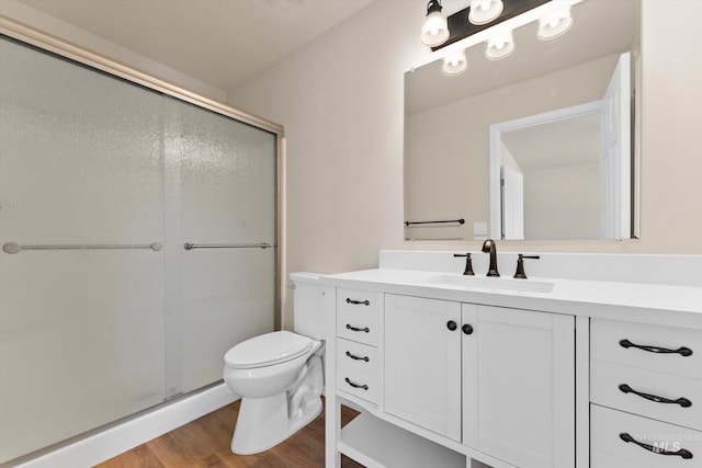 1406 W Wright St, Boise, ID 83705 - bathroom with vanity, toilet, a shower stall, and wood finished floors