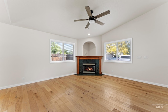 1406 W Wright St, Boise, ID 83705 - unfurnished living room with a fireplace, light wood finished floors, vaulted ceiling, a ceiling fan, and baseboards