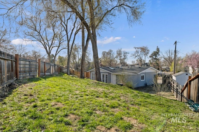 view of yard with a fenced backyard