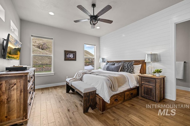 bedroom with recessed lighting, light wood-style flooring, baseboards, and ceiling fan