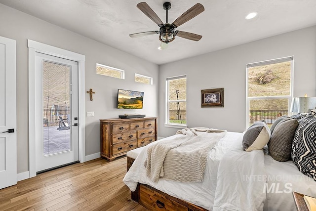 bedroom featuring baseboards, light wood finished floors, recessed lighting, ceiling fan, and access to outside