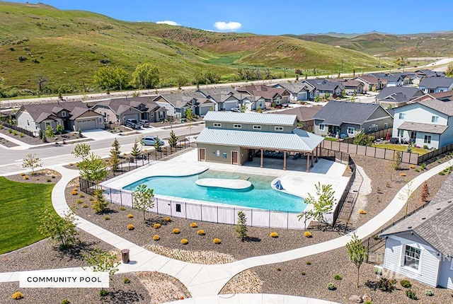 aerial view featuring a mountain view and a residential view