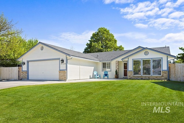 2189 W Rainfall St, Meridian, ID 83646 - single story home featuring an attached garage, concrete driveway, and brick siding