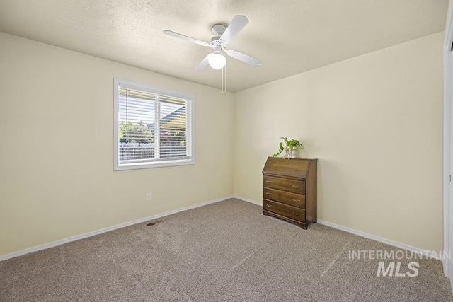 2189 W Rainfall St, Meridian, ID 83646 - carpeted spare room featuring baseboards, ceiling fan, and a textured ceiling