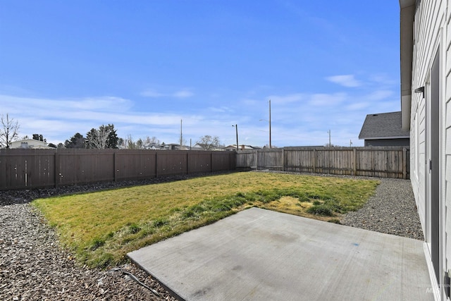 view of yard with a patio and a fenced backyard