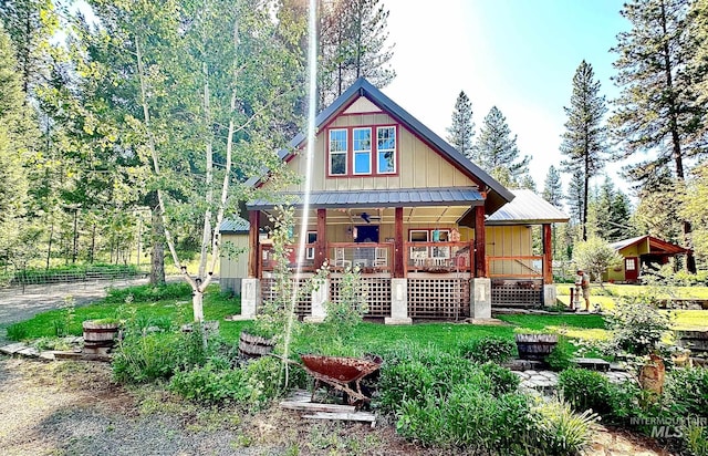 3617 Rubicon St, New Meadows, ID 83612 - view of front of house featuring a porch, stairs, metal roof, and board and batten siding