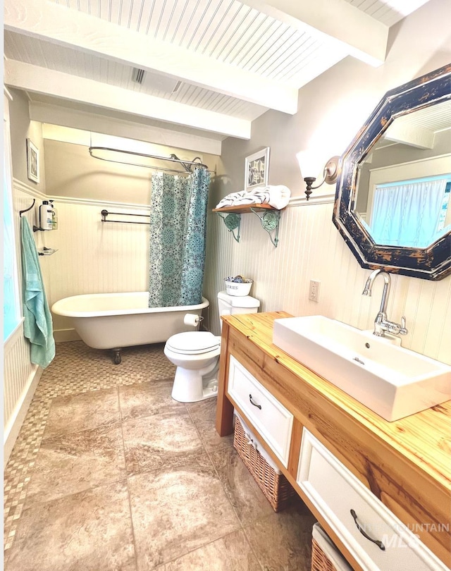 3617 Rubicon St, New Meadows, ID 83612 - full bathroom featuring a tub to relax in, toilet, beamed ceiling, vanity, and a shower with shower curtain