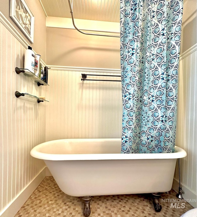 3617 Rubicon St, New Meadows, ID 83612 - bathroom featuring a freestanding tub and a wainscoted wall