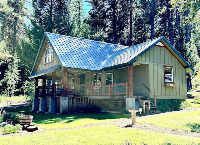 3617 Rubicon St, New Meadows, ID 83612 - view of front of property featuring covered porch, a front yard, and board and batten siding