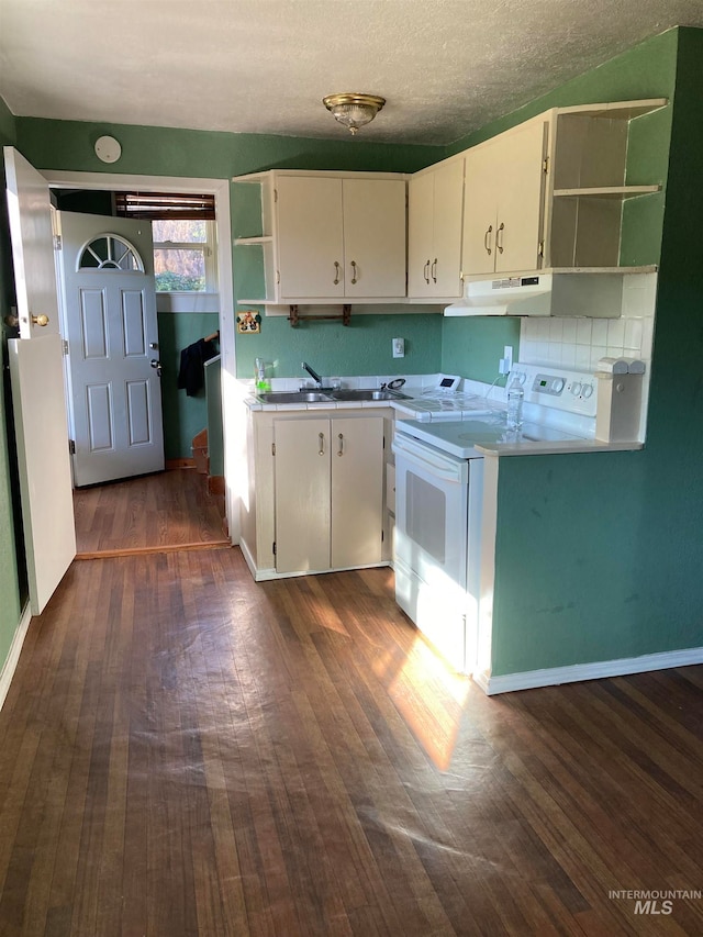 kitchen with a textured ceiling, white cabinetry, electric stove, and dark wood-type flooring