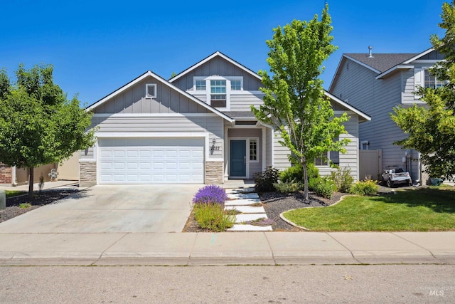 12022 W Ardyce, Boise, ID 83713 - view of front of property with a garage, board and batten siding, concrete driveway, and stone siding