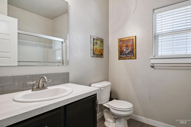 12022 W Ardyce, Boise, ID 83713 - bathroom featuring vanity, tasteful backsplash, and an enclosed shower