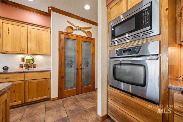 1770 N 3rd St, Nyssa, OR 97913 - kitchen featuring stainless steel appliances, french doors, and stone countertops