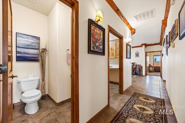 1770 N 3rd St, Nyssa, OR 97913 - corridor featuring tile patterned flooring, baseboards, and ornamental molding