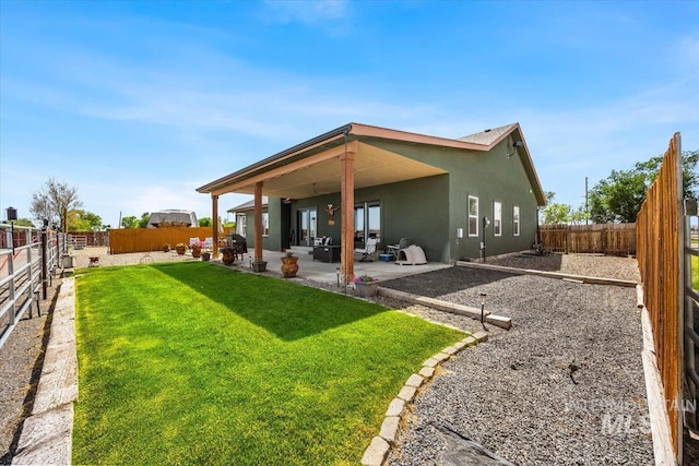1770 N 3rd St, Nyssa, OR 97913 - rear view of house with stucco siding and a patio area