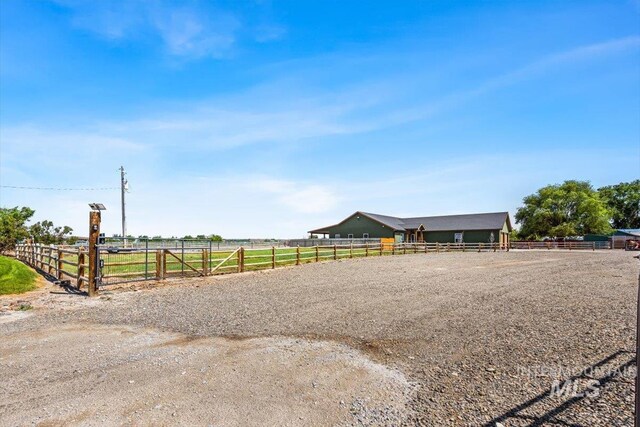 1770 N 3rd St, Nyssa, OR 97913 - view of front of house featuring an outdoor riding arena and a view of rural / pastoral area