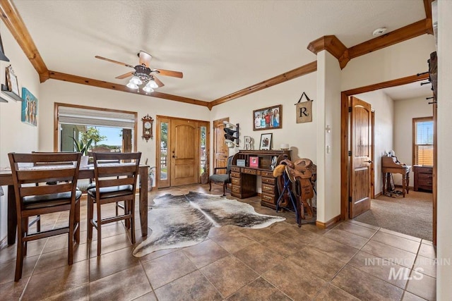 1770 N 3rd St, Nyssa, OR 97913 - dining space featuring healthy amount of natural light, a ceiling fan, baseboards, and ornamental molding
