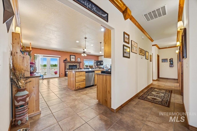 1770 N 3rd St, Nyssa, OR 97913 - kitchen with dishwasher, open floor plan, a ceiling fan, ornamental molding, and dark countertops