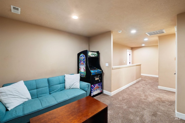 living area featuring recessed lighting, carpet flooring, visible vents, and baseboards